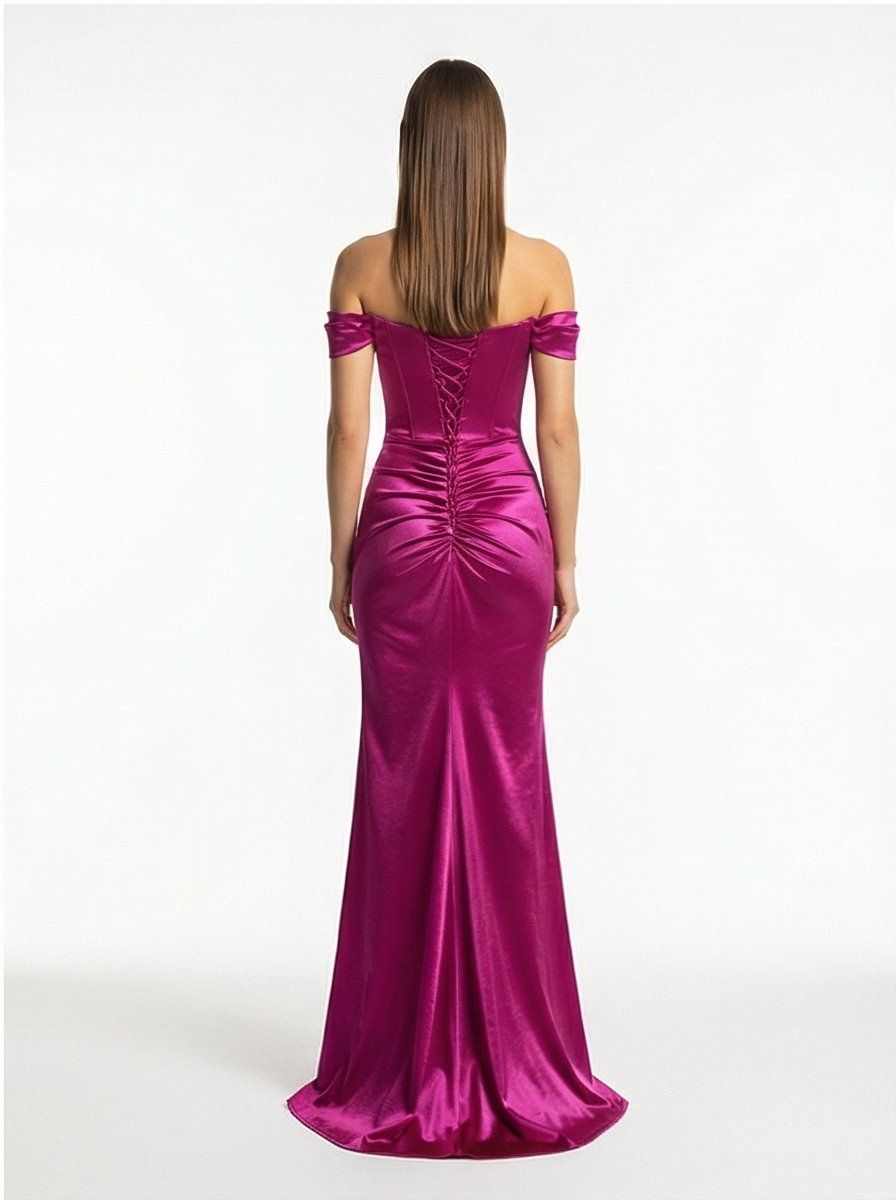 Woman wearing a magenta off-shoulder evening gown on a white background