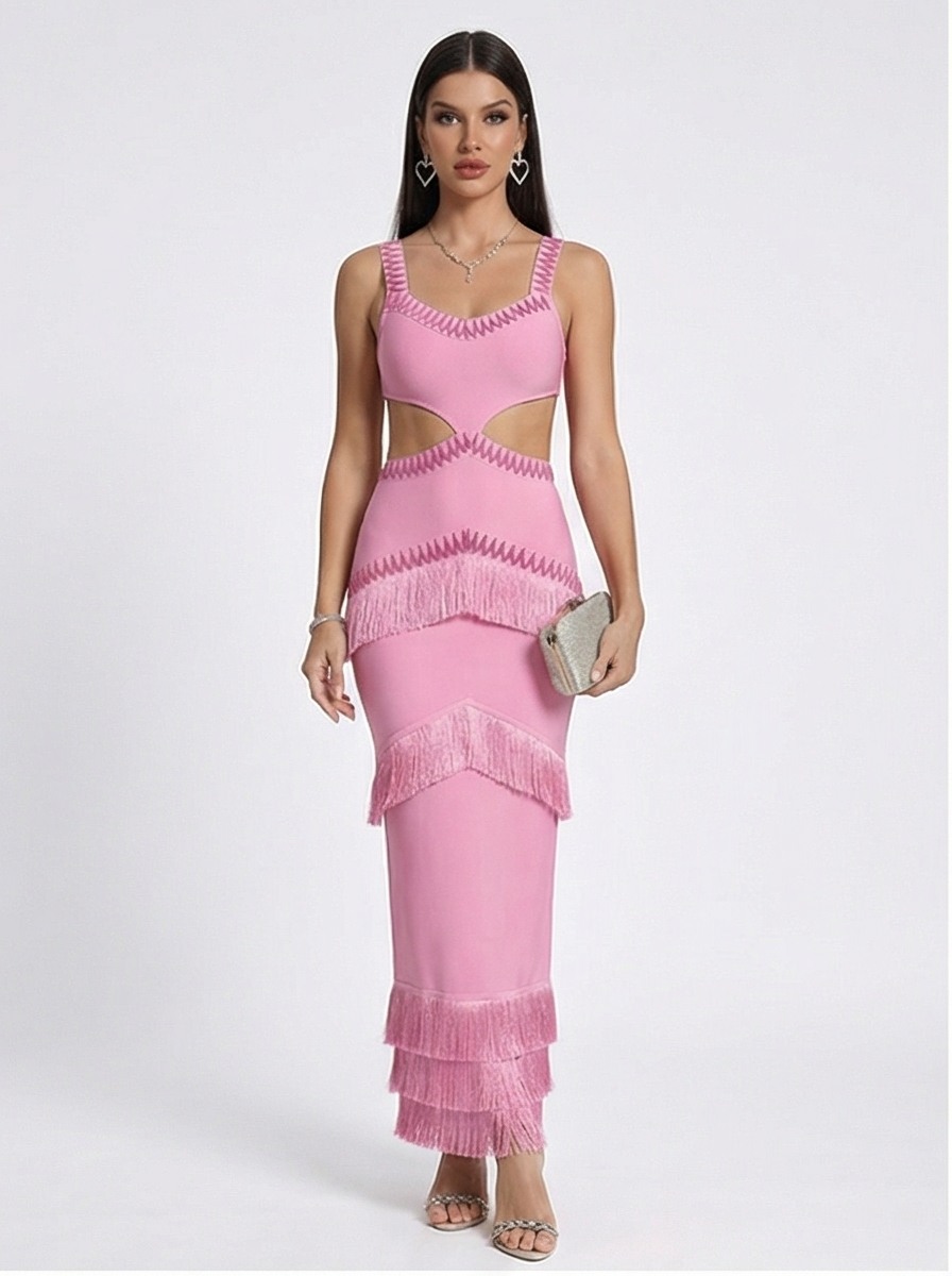 Woman wearing a pink dress with cut-out design on a white background