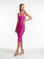 Woman wearing a vibrant pink dress on a white background