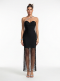 Black strapless gown with sheer fringe details on a white background