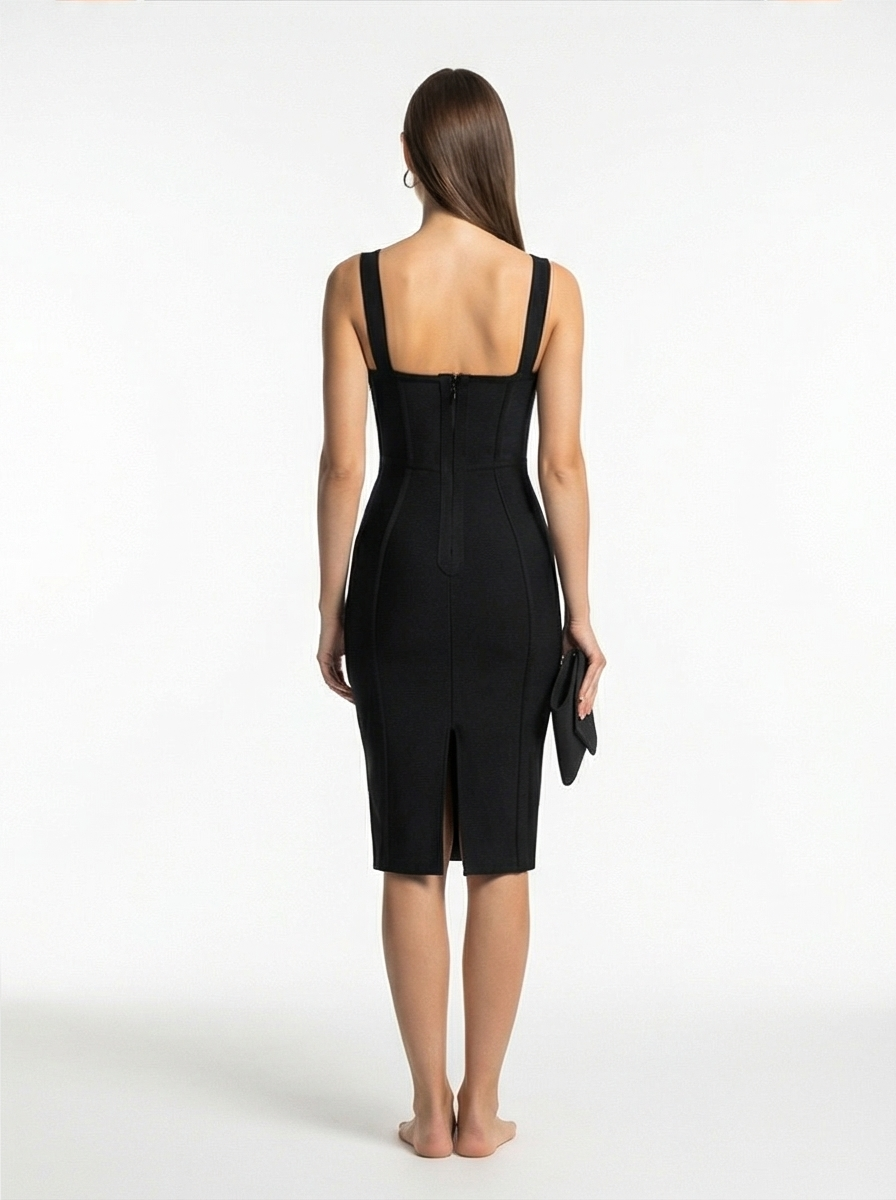 Woman wearing a black dress with a white background