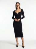 Woman wearing a black dress on a white background