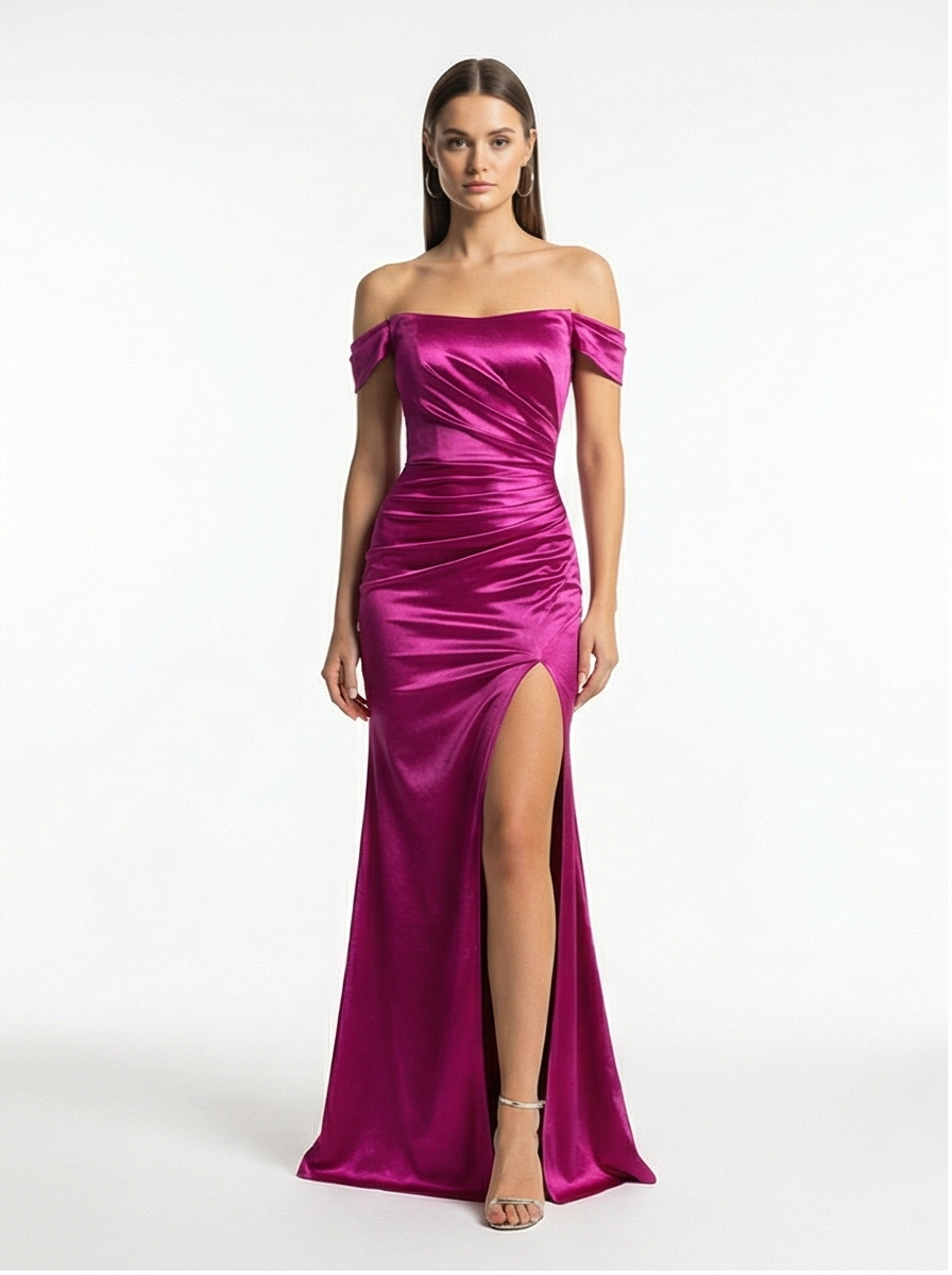 Woman wearing a vibrant pink off-shoulder gown with a high slit on a white background