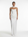 Woman wearing a white strapless gown on a white background