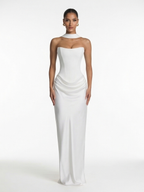 Woman wearing a white strapless gown on a white background