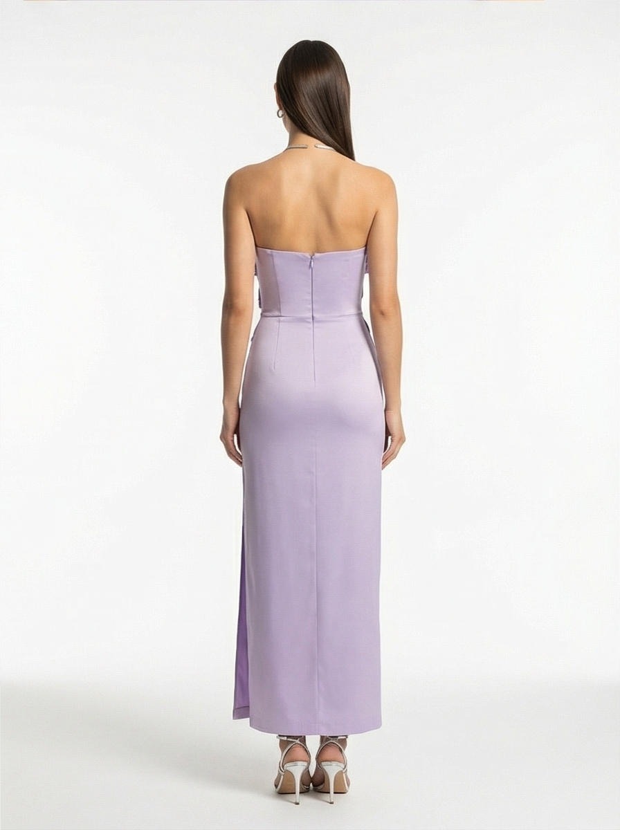 Woman wearing a strapless lavender gown on a white background