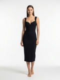 Woman wearing a black dress on a white background