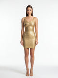 Woman wearing a gold dress on a white background