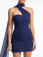 Navy blue halter neck dress with draped design on a white background