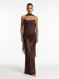 Woman wearing a brown strapless gown on a white background