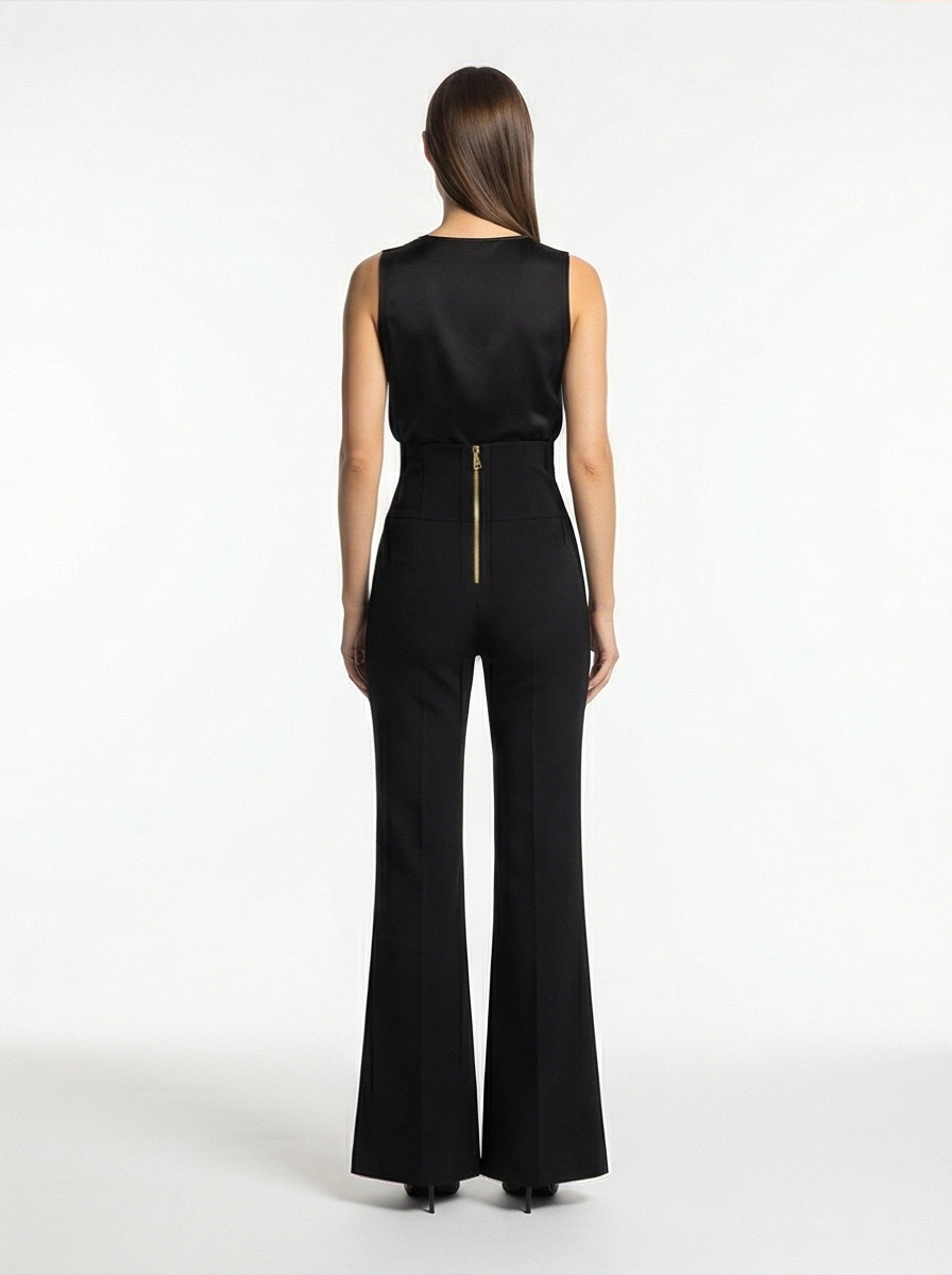 Black jumpsuit worn by a model on a white background
