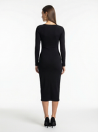 Woman wearing a black dress on a white background