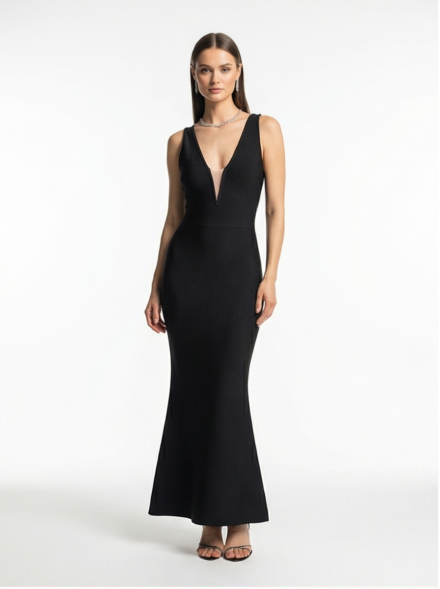 Woman wearing a black evening gown on a white background