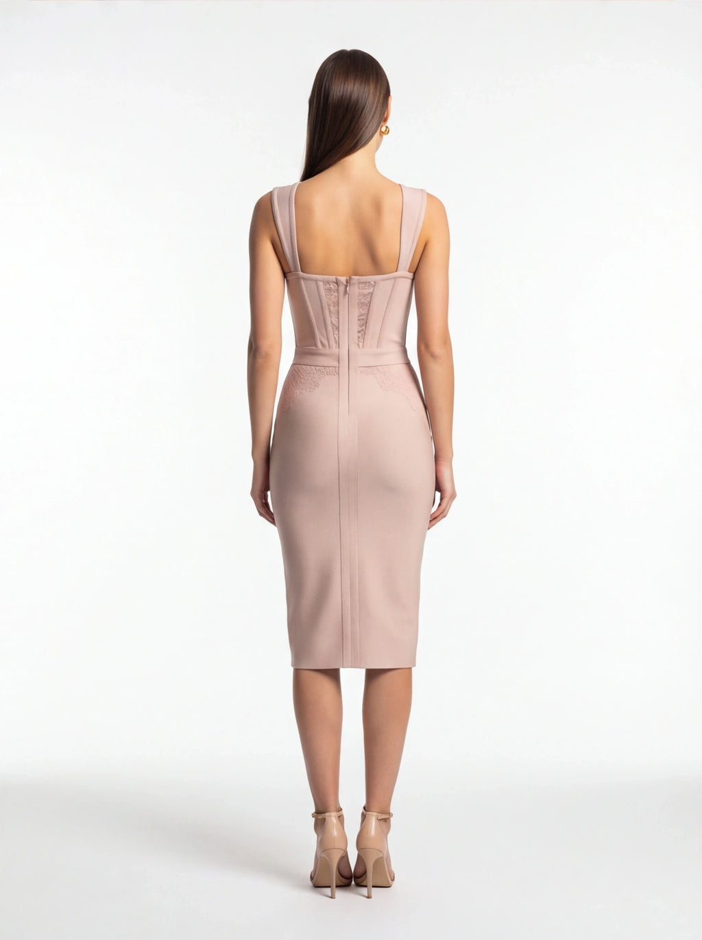Woman wearing a pink dress on a white background