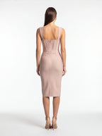 Woman wearing a pink dress on a white background