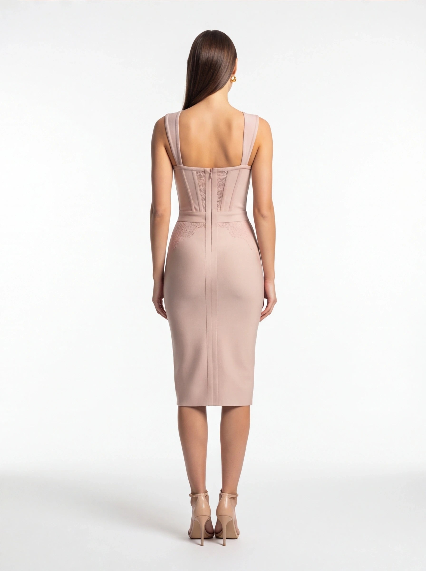 Woman wearing a pink dress on a white background