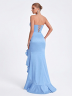 Light blue strapless gown with ruffled details on a white background