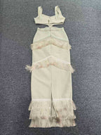 Beige fringe dress and top set on a gray background