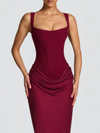 Burgundy evening gown on a plain background