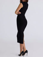 Black sleeveless dress with a high slit on a white background