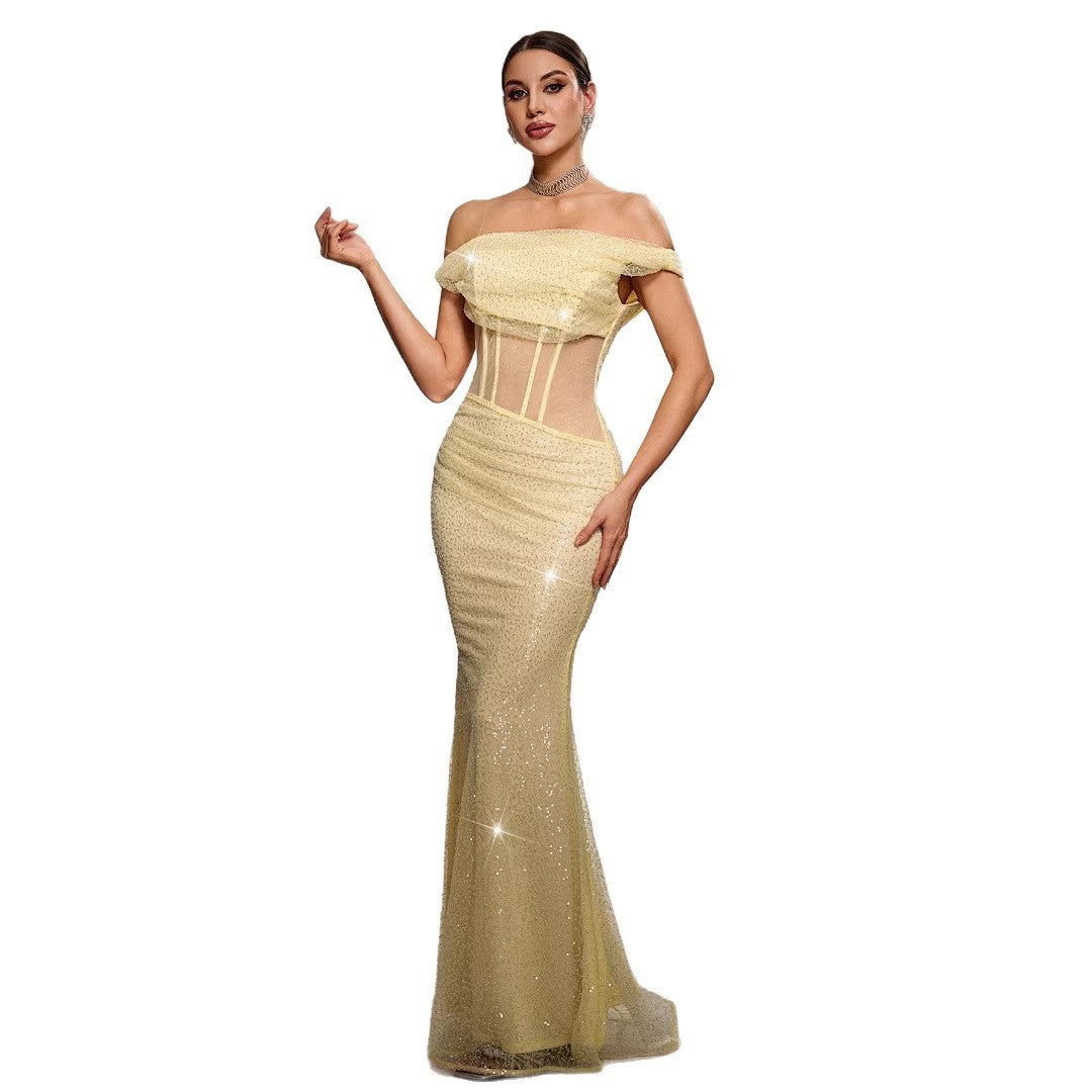 Woman wearing a gold evening gown on a white background