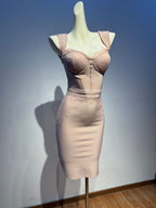 Mannequin wearing a beige shapewear garment against a plain background