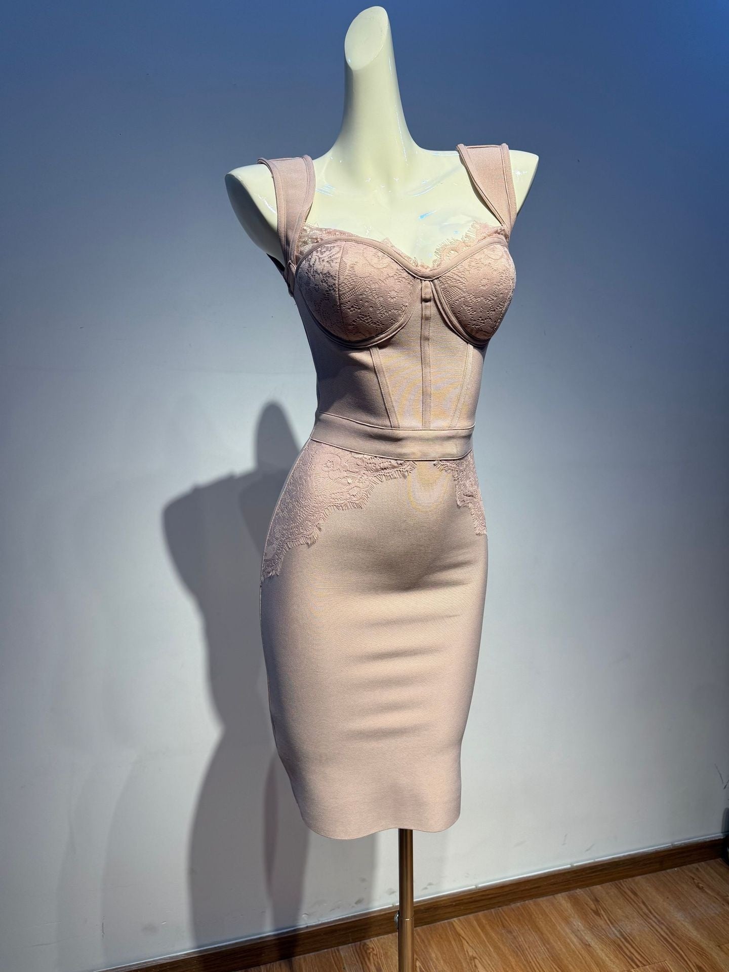Mannequin wearing a beige shapewear garment against a plain background
