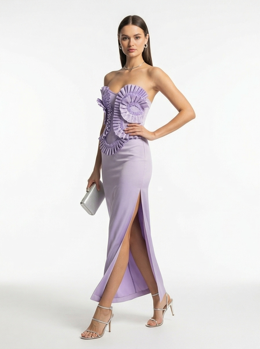 Woman wearing a strapless lavender evening gown with floral details on a white background