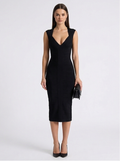 Woman wearing a black dress on a white background