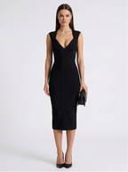 Woman wearing a black dress on a white background
