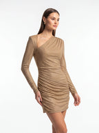 Woman wearing a beige long-sleeve dress on a white background