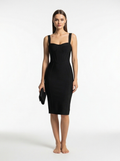 Woman wearing a black dress on a white background