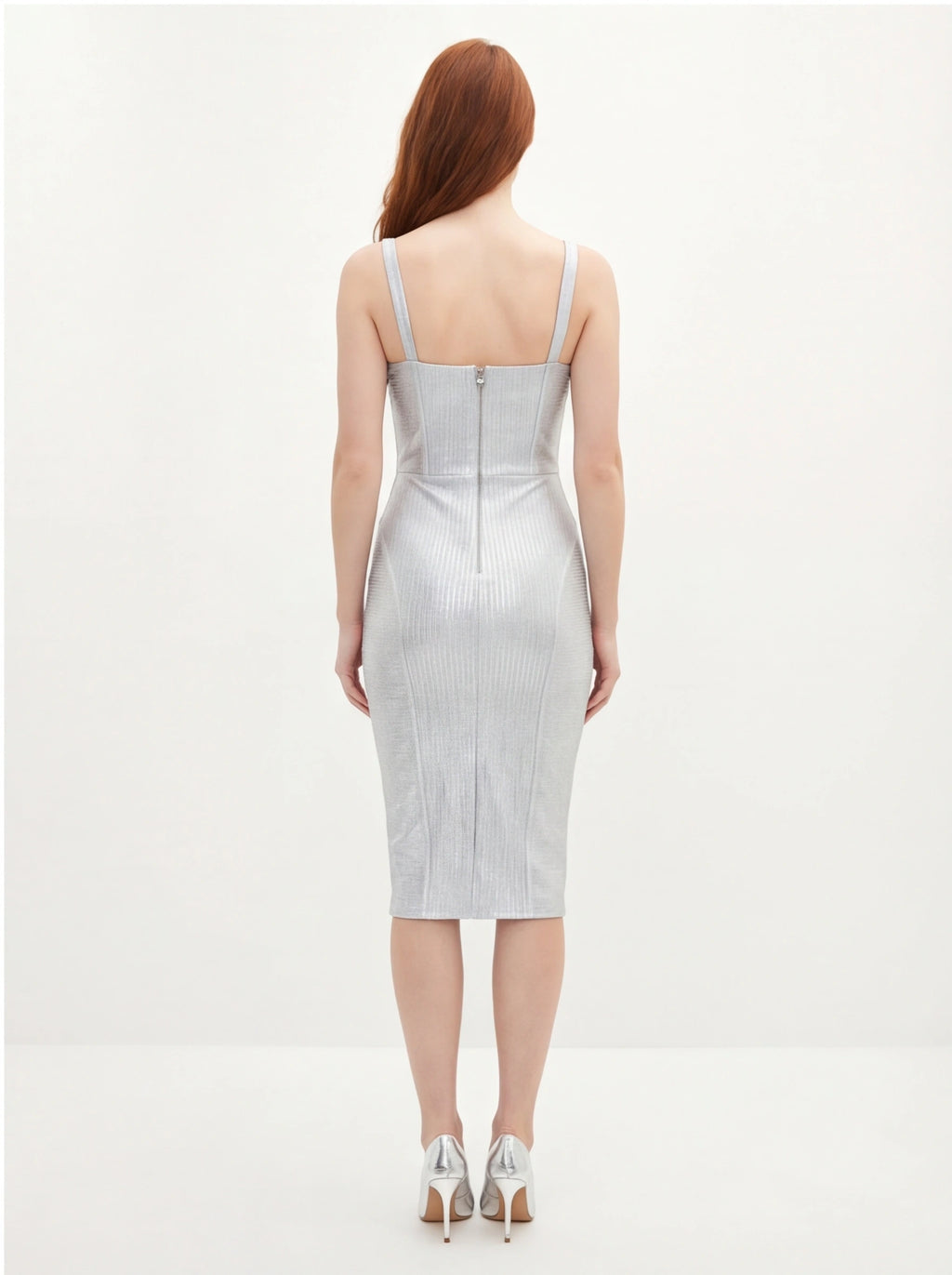 Woman wearing a silver dress on a white background