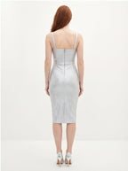 Woman wearing a silver dress on a white background