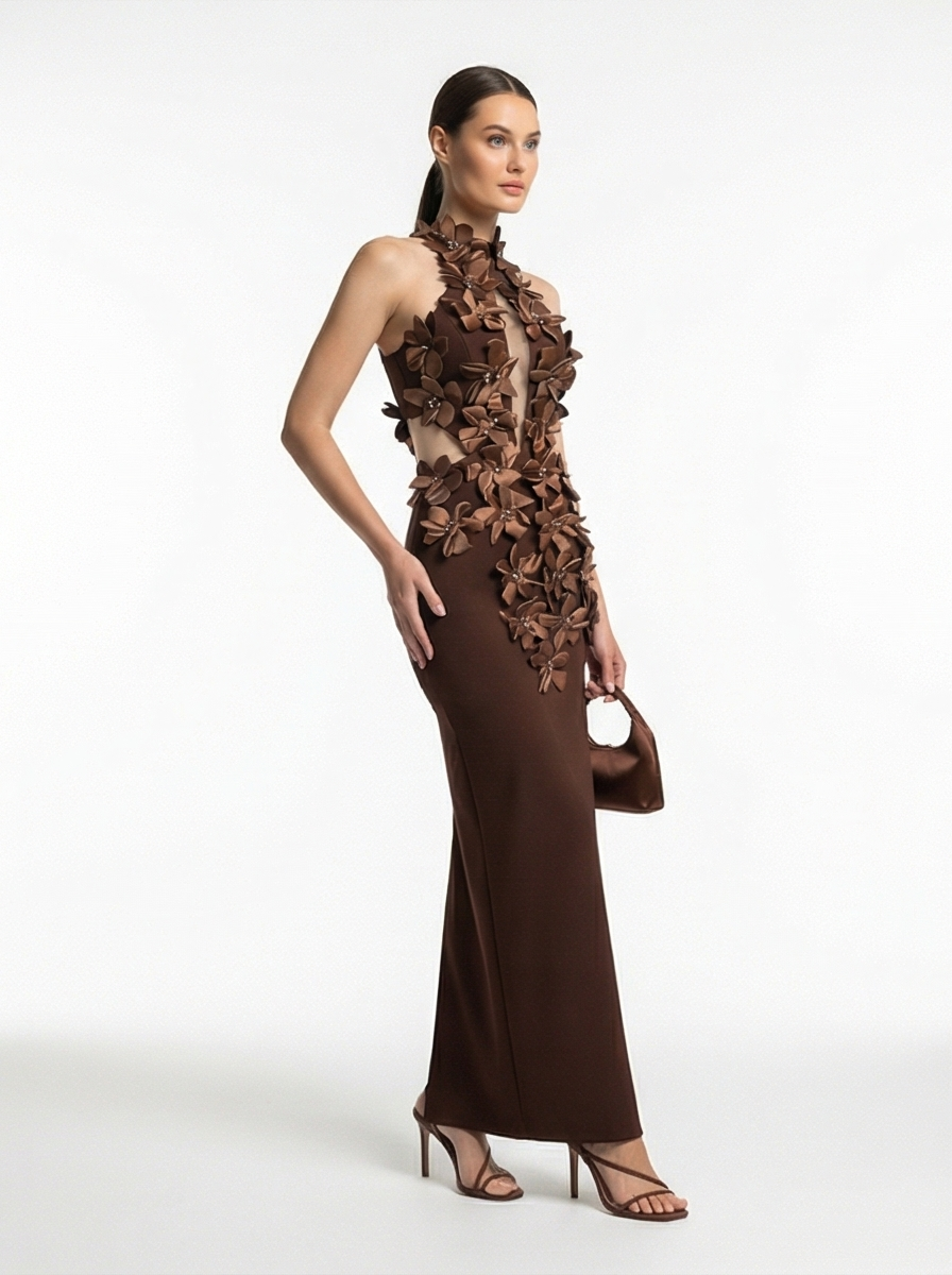 Woman wearing a brown floral evening gown on a white background