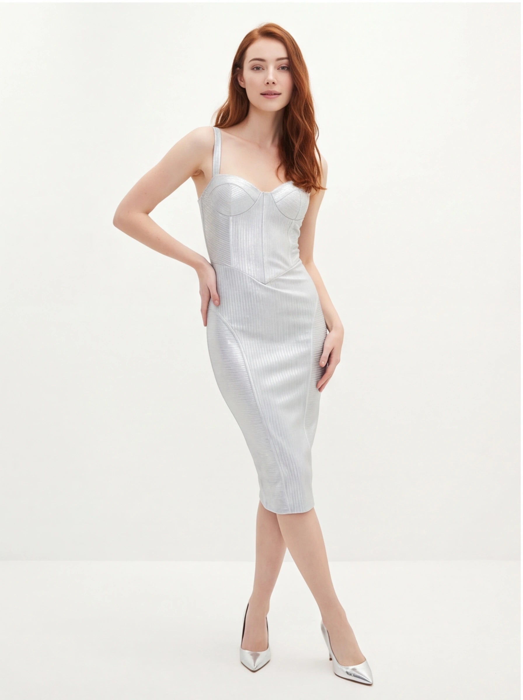 Woman wearing a silver dress on a white background