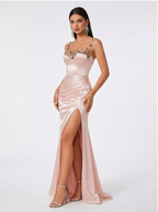 Pink evening gown with floral details on a white background