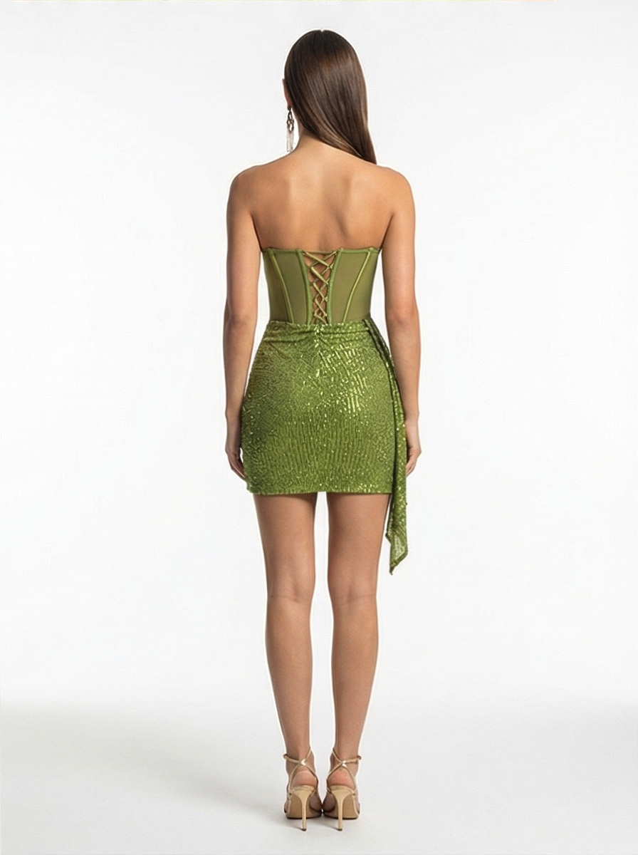 Green strapless dress with lace-up back on a white background