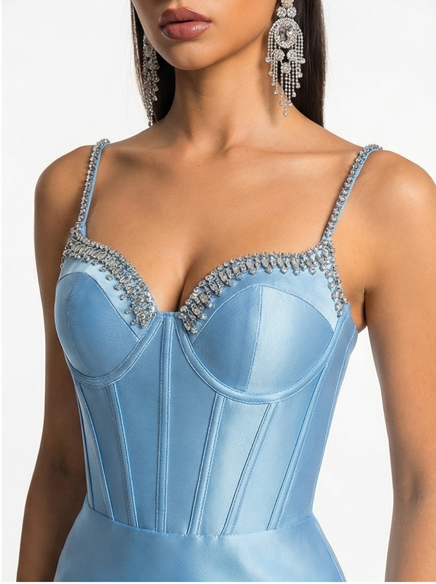 Light blue corset with intricate detailing on a neutral background