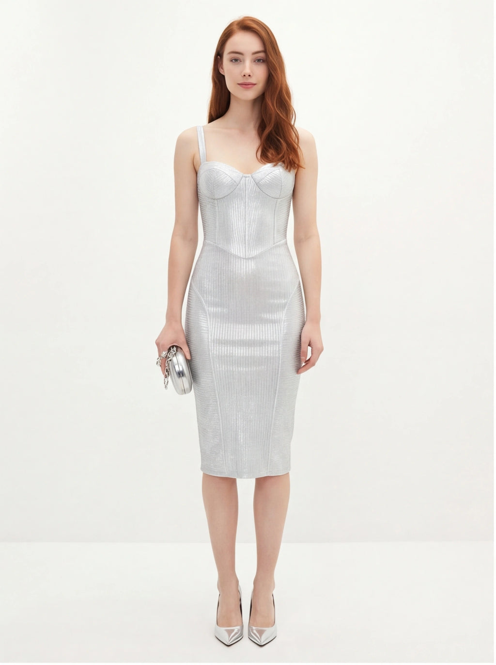 Woman wearing a silver dress on a white background