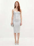 Woman wearing a silver dress on a white background