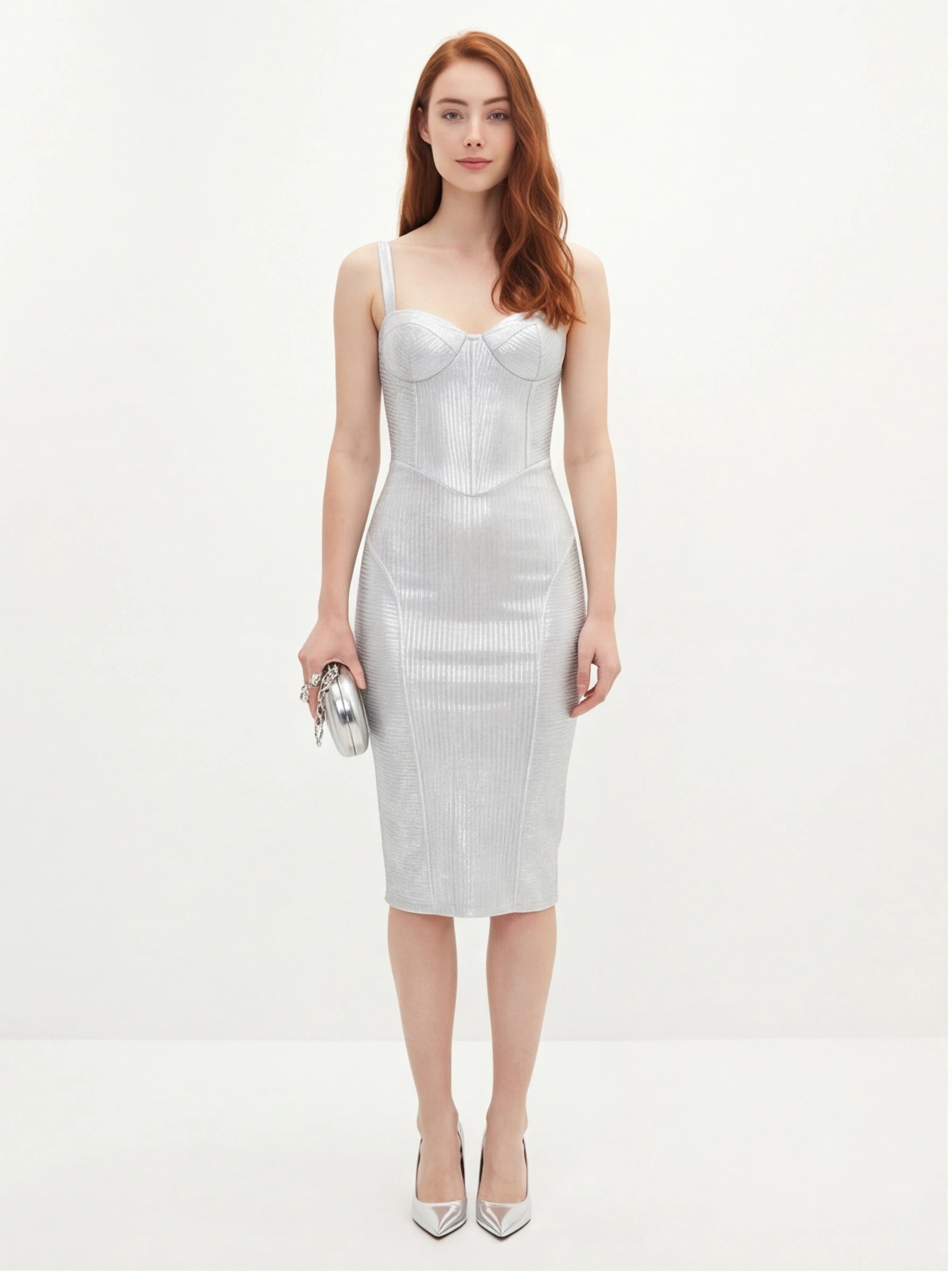 Woman wearing a silver dress on a white background