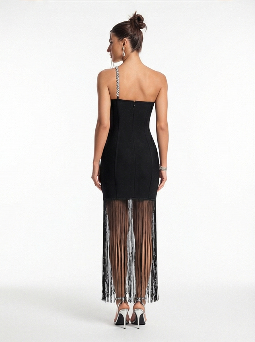 Black dress with sheer side panels worn by a model on a white background