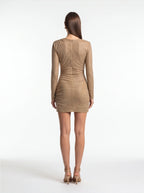 Woman wearing a beige dress on a white background
