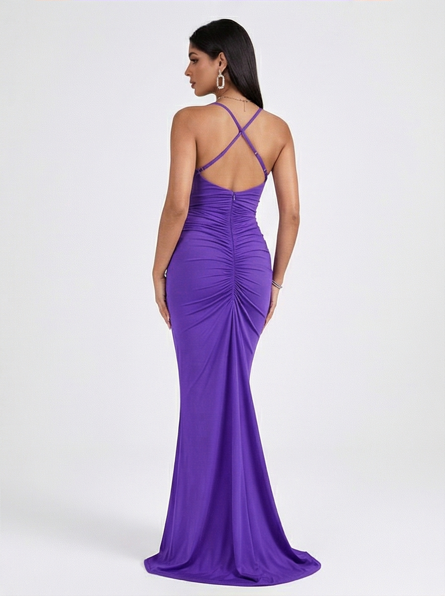 Woman wearing a purple evening gown on a white background
