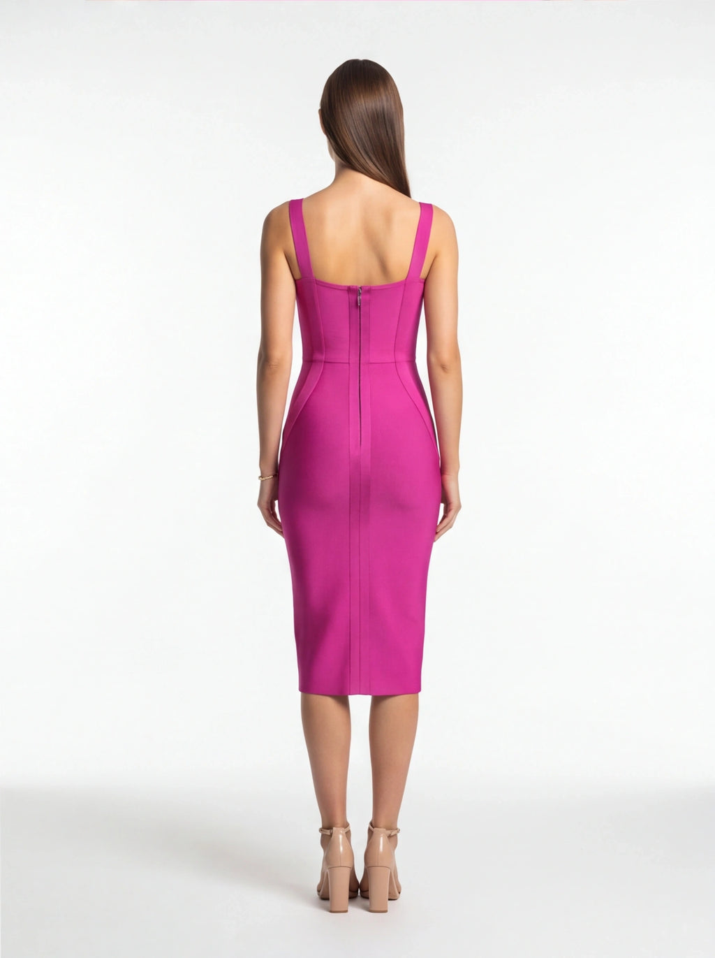Woman wearing a pink dress on a white background