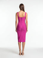 Woman wearing a pink dress on a white background