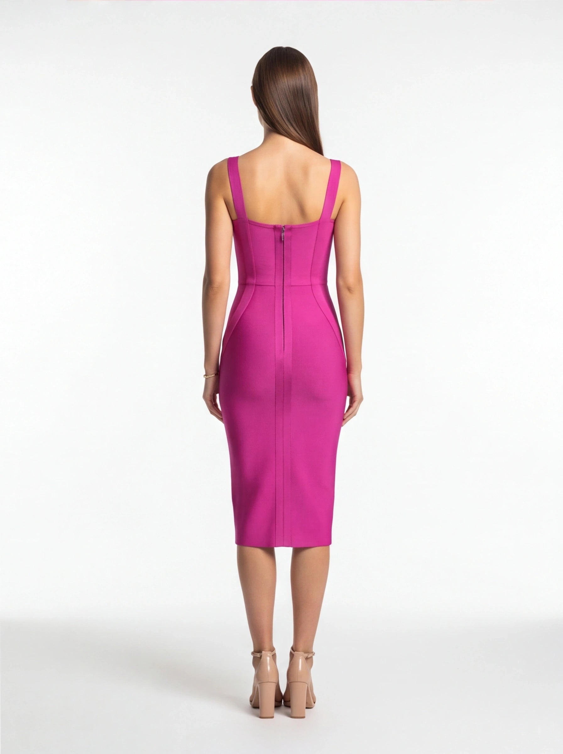 Woman wearing a pink dress on a white background
